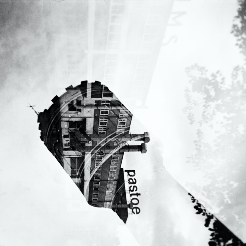 a double exposure, shot of Pastoe factory and water tower